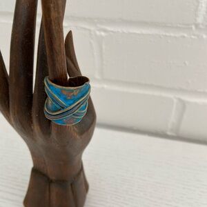 Patina brushed gold-blue adjustable ring with cross-cross design on top